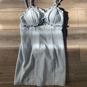 Blue denim mini dress open chest padded bra with ruffles. Bodycon tight fitting